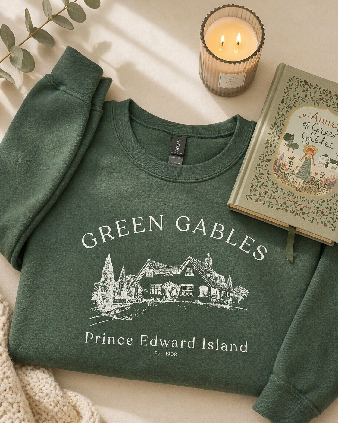 Cozy green gables sweatshirt with vintage literary design styled in neutral aesthetic flatlay