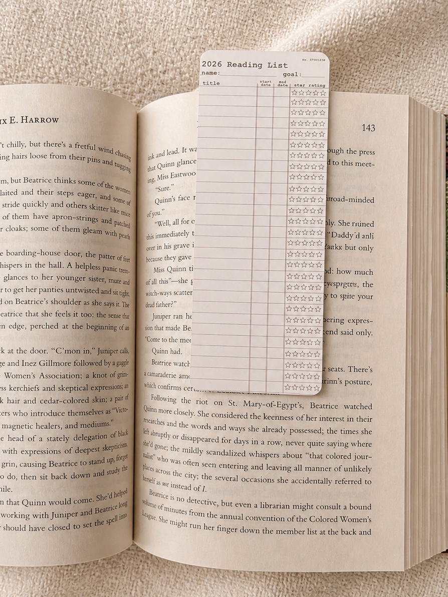 Open book with a reading list on a textured surface