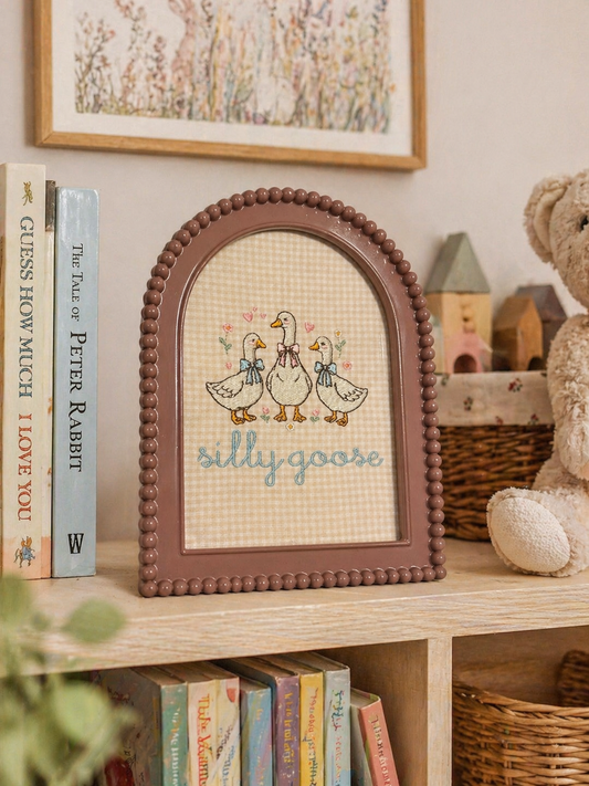 A embroidered frame in a childs room