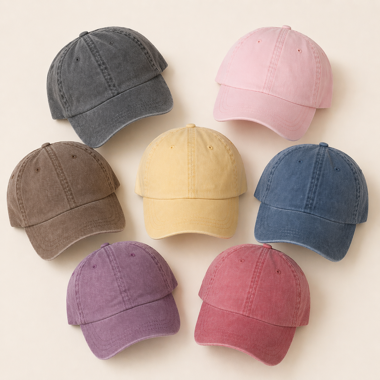 Set of eight baseball caps in various colors on a light beige background