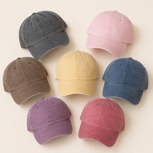 Set of eight baseball caps in various colors on a light beige background