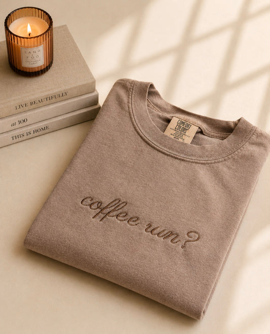 Espresso Comfort Colors t-shirt featuring a minimalist embroidered Coffee Run design in cream thread.