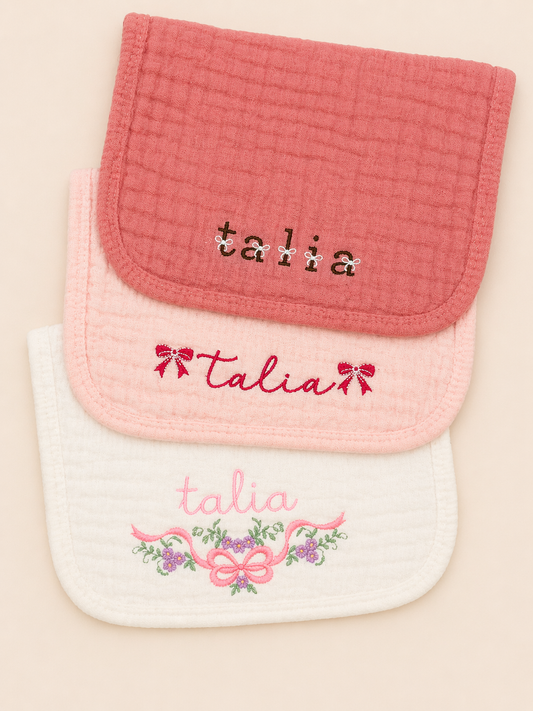 Personalized muslin burp cloths in neutral and pastel colors