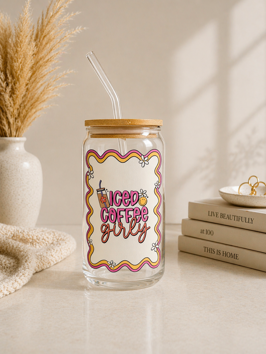 girly iced coffee glass cup with feminine aesthetic design on neutral background with bamboo lid and glass straw