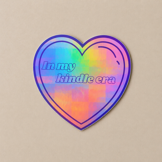 Heart-shaped sticker with rainbow gradient and text 'In my kindle era' on a beige background