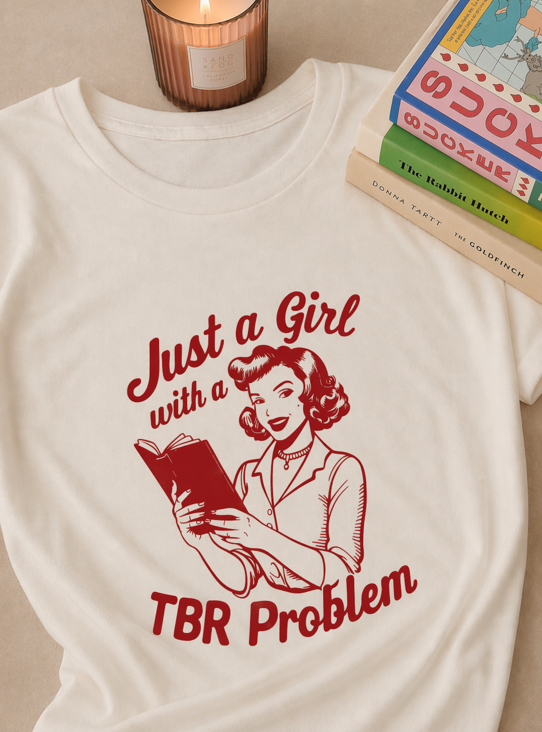 white graphic t-shirt with just a girl with a tbr problem book lover design